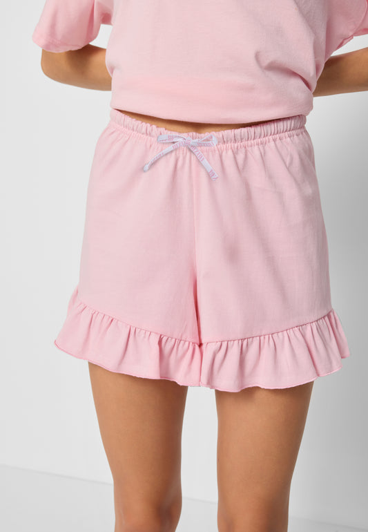 Zbliżenie na spodenki od piżamy LIMA na modelce.