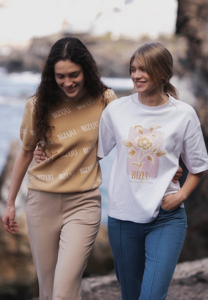 Kremowy T-shirt oversize z grafiką VIORA