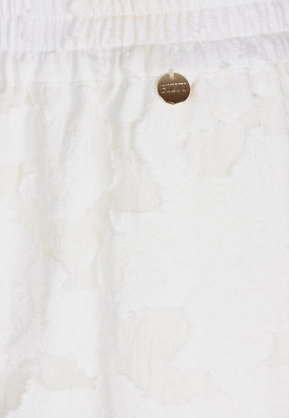 Kremowe spodnie w kwiatowy wzór LAVENDOU