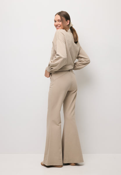 Beżowe spodnie dresowe typu flare ZEIA