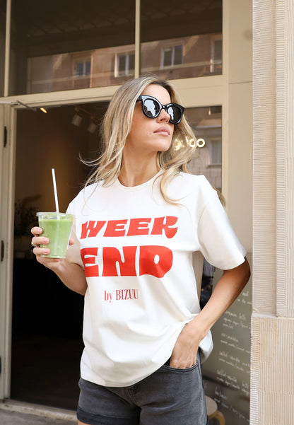 Kremowy T-shirt oversize z nadrukiem RALZA