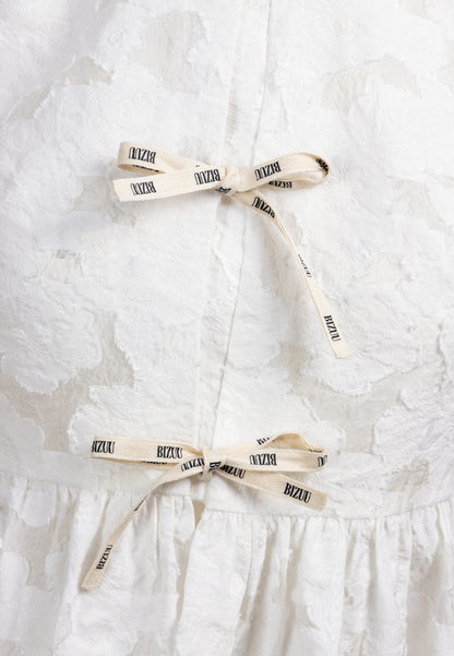 Kremowa bluzka z ozdobnymi wiązaniami SAVENNE