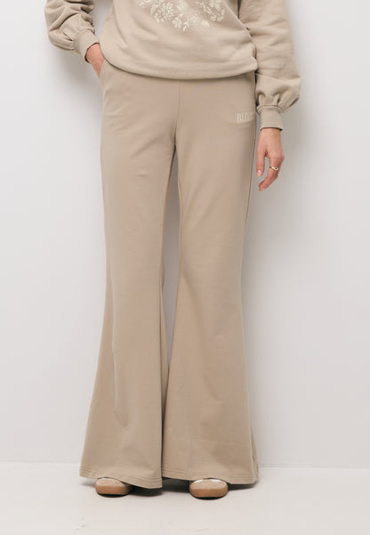 Beżowe spodnie dresowe typu flare ZEIA